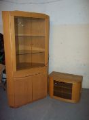 A MODERN MEDIA UNIT STAND AND A CORNER DISPLAY UNIT