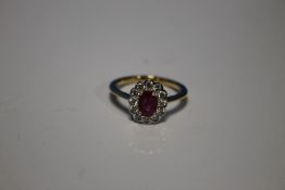 18 CT YELLOW GOLD OVAL CUT RUBY AND RBC DIAMOND CLUSTER RING, RUBY 0.80 CT, DIAMONDS 0.40 CT