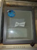 A BUDWEISER TABLE TOP FRIDGE WITH GLASS FRONT