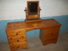 A SOLID PINE TWIN PEDESTAL DRESSING TABLE AND ADDITIONAL SWING MIRROR