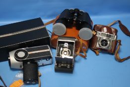 A PAIR OF BINOCULARS , A EUMIG SUPER-8 CAMERA, A KODAK FOLDING CAMERA ETC.