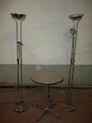 A STAINLESS STEEL TABLE AND TWO MODERN UPLIGHTER LIGHTS, LOW ENERGY