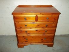 A SOLID PINE DUCAL CHEST OF DRAWERS, TWO OVER THREE
