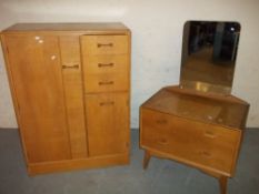 A RETRO G-PLAN OAK TWO PIECE BEDROOM SUITE INCLUDING A TALLBOY AND A DRESSING TABLE