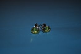 A PAIR OF PERIDOT SILVER STUDS