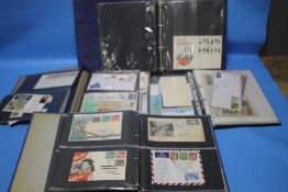 FOUR ALBUMS OF COVERS AND FDC BRITISH AND WORLD STAMPS, to include some 19th century examples and