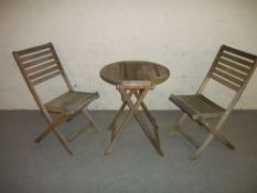 A FOLD AWAY WOODEN PATIO SET