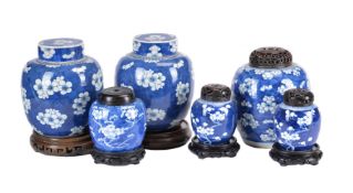 A pair of Chinese blue and white ginger jars and covers