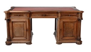 A Continental walnut twin pedestal desk