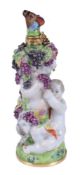 A Charles Gouyn St. James's factory type scent bottle and stopper of Bacchic putti with a faun