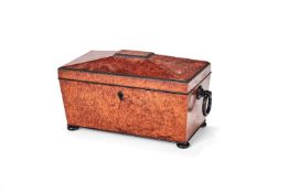 ϒ A large George IV amboyna and ebonised tea caddy, circa 1825