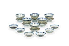 A set of six Chinese 'Linglong' rice bowls, covers and stands, late 19th century