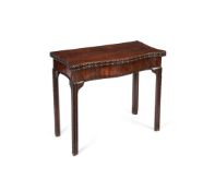 A pair of George III mahogany serpentine card tables, circa 1760, in the manner of Wright and Elwick