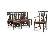 A matched set of seven George II style carved mahogany dining chairs, late 19th century