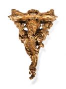 A George II carved giltwood wall bracket, circa 1750, in the manner of Matthias Lock