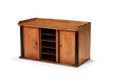 A Biedermeier Karlelian birch and ebonised table cabinet, first half 19th century