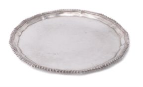 A silver shaped circular salver
