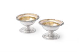 A pair of George III silver pedestal salt cellars by Robert Sharp