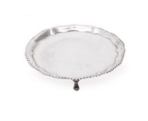 A George III silver shaped circular waiter by Richard Rugg I