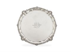 A large Edwardian silver shaped circular salver by Harrison Brothers & Howson