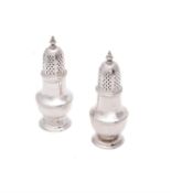 A pair of George II silver pepperettes by Samuel Wood