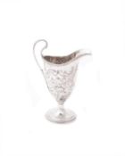A George III silver helmet shaped cream jug