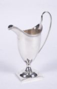 A George III silver helmet shaped cream jug by Charles Hougham