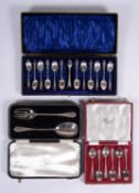 A cased set of twelve silver engraved tea spoons and sugar tongs by John Round & Son