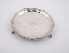 An Edwardian shaped circular waiter by Thomas Bradbury & Sons