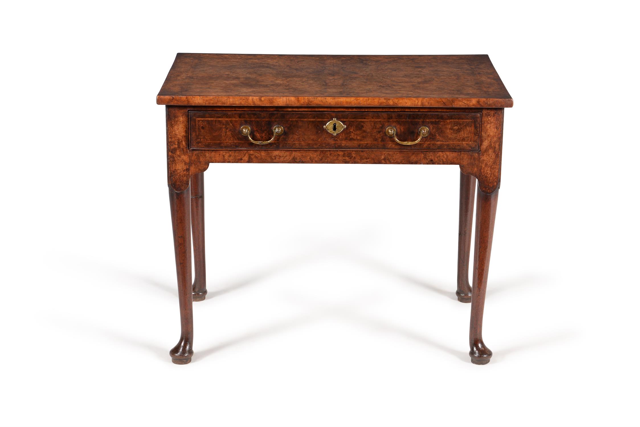 A George II figured walnut and feather banded side table, circa 1740