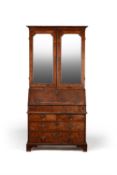 A George II walnut and crossbanded bureau bookcase, circa 1735