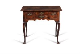 A George II walnut, burr walnut and feather banded side table, circa 1735