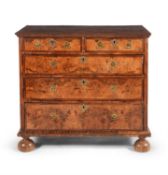 A William & Mary walnut, figured walnut and feather banded chest of drawers, circa 1690