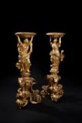 A pair of George I carved giltwood vase stands, circa 1720