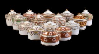 A collection of fifteen various English porcelain oval section sugar boxes and covers