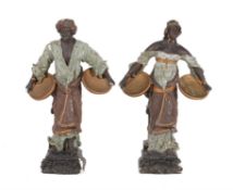 A pair of painted plaster models of Blackamoor figures