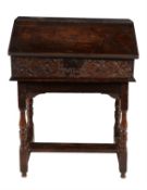 A carved oak bible box on stand