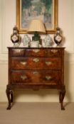 A George II walnut chest on stand
