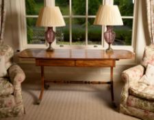 A Regency mahogany and inlaid sofa table