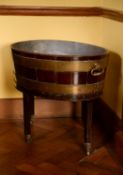 A George III mahogany and brass bound wine cooler