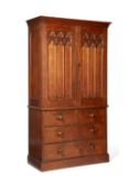 A Victorian oak Gothic Revival linen press