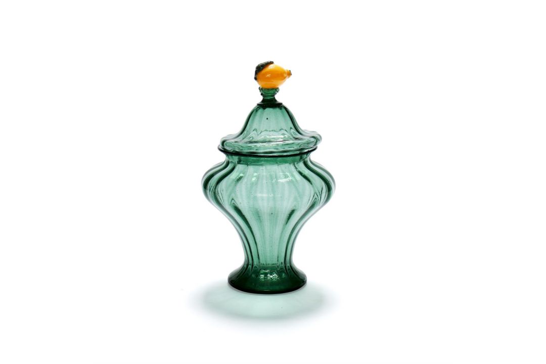 An Italian green glass covered vase with lemon finial