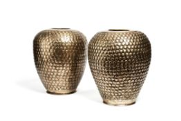 A pair of Indian silvered brass repoussé vases