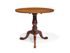 A George III oak and elm tilt top occasional table