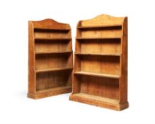 A pair of Regency pine 'waterfall' open bookcases