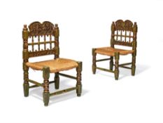 A pair of Spanish green painted and parcel giltwood side chairs