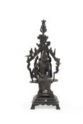 A Chinese bronze figure of the Water-Moon Guanyin in a grotto
