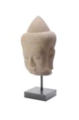 A sandstone Bayon style head of Buddha