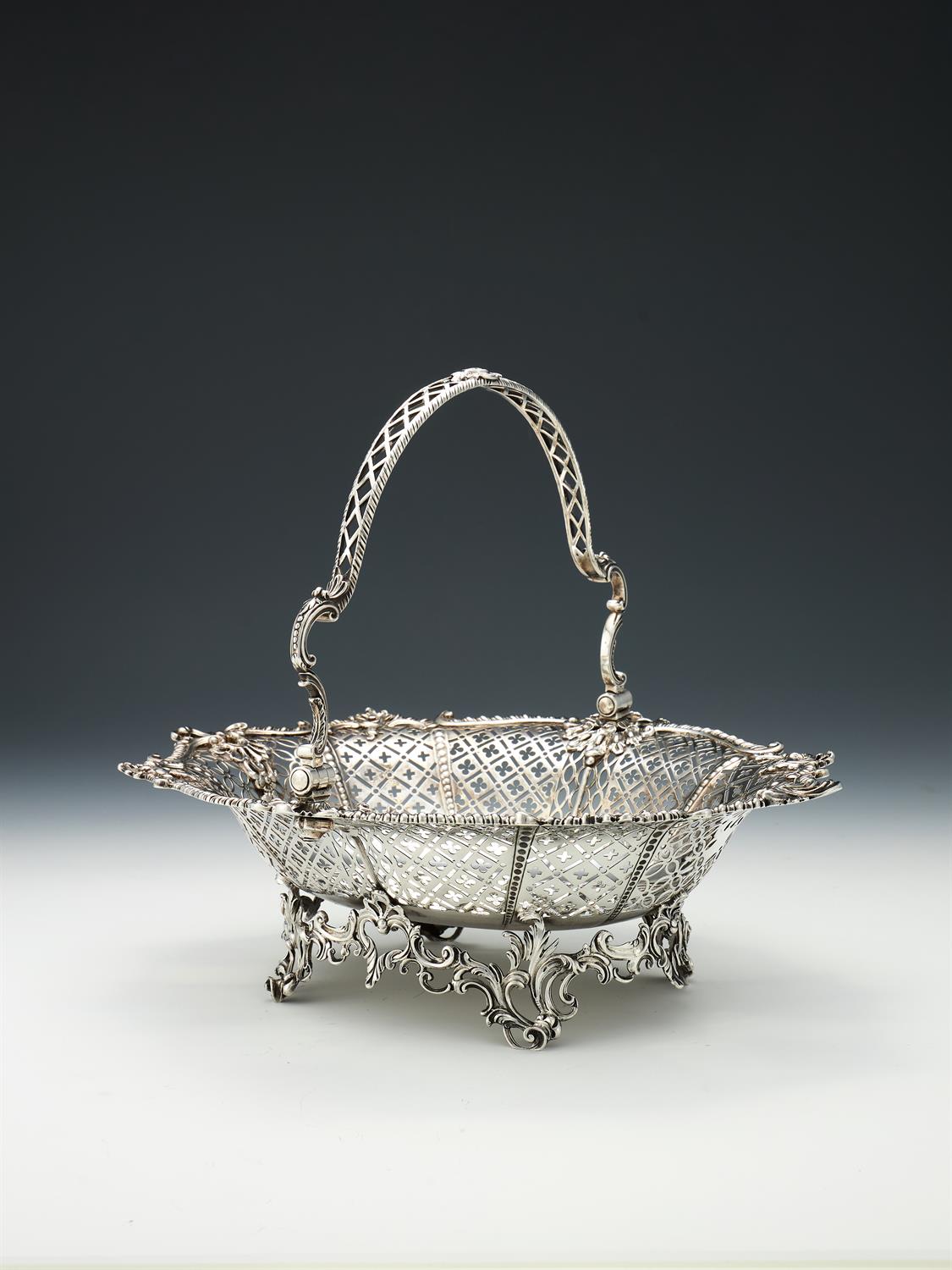 A George III silver swing handled basket by William Plummer