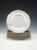A set of twelve late George III silver hexafoil soup plates by Paul Storr